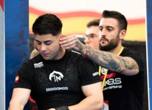 Andrés Fernández y su entrenador, Óscar Sánchez.